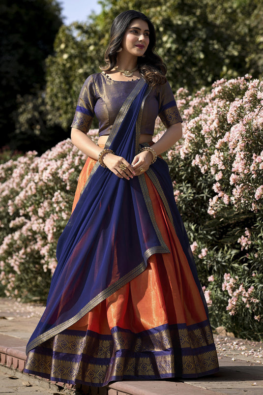 Kanchipuram With Zari Weaving Art Silk Function Wear Ravishing Lehenga In Orange Color