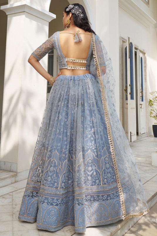 Soothing Sequins Work On Blue Color Net Fabric Lehenga