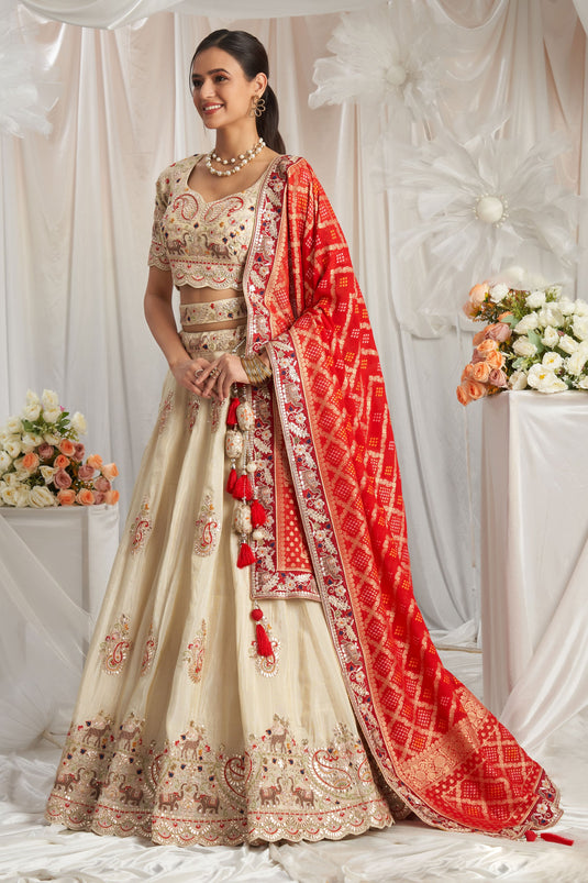 Flawless Tissue Thread Embroidery Cream And Red Lehenga Choli