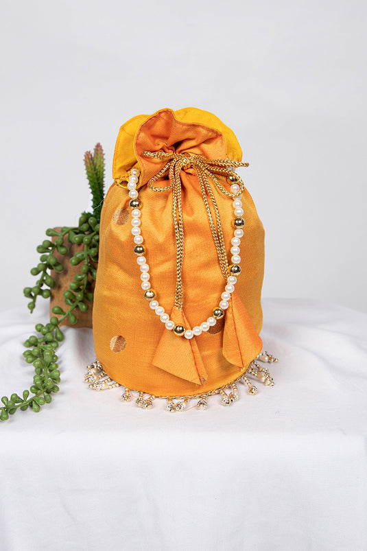 Luxurious Art Silk Jacquard Work Yellow Color Potli Bag With Moti Handle