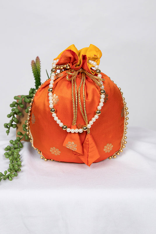 Exquisite Jacquard Work Art Silk Orange Color Potli Bag With Moti Handle