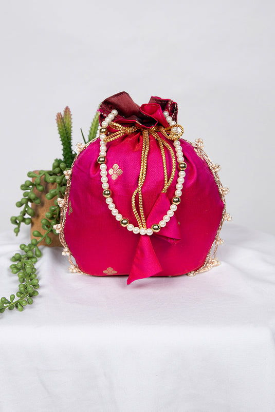 Delicate Art Silk Jacquard Work Rani Color Potli Bag With Moti Handle