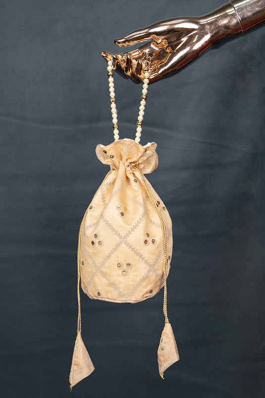 Classic Art Silk Jacquard Work Potli Bag With Moti Handle In Cream Color