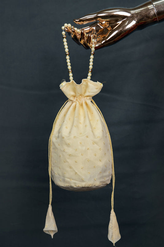 Alluring Art Silk Jacquard Work Potli Bag With Moti Handle In Cream Color