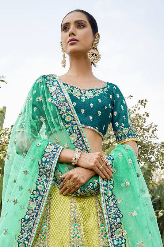 Jacquard Work On Multi Color Sober Lehenga In Banarasi Silk Fabric