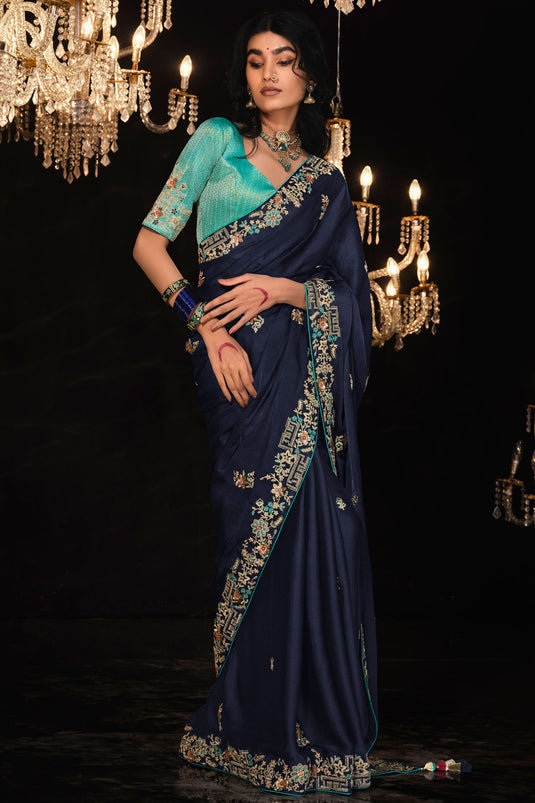 Beguiling Embroidered Work On Blue Color Tissue Fabric Saree