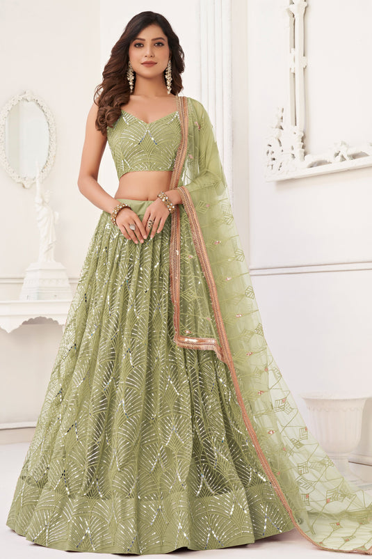 Net Fabric Function Wear Magnificent Lehenga In Green Color With Sequins Work