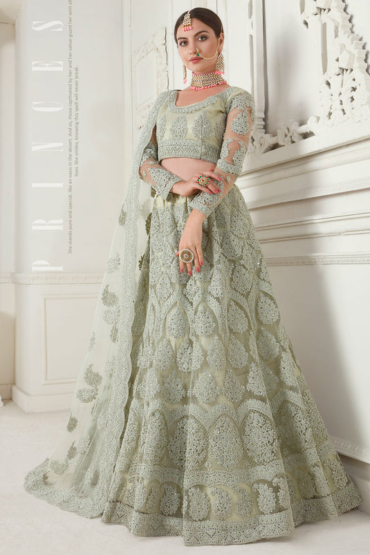 Embroidery Work On Sea Green Color Sober Lehenga In Net Fabric