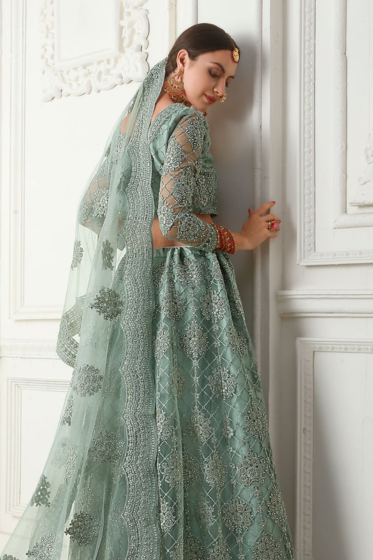Excellent Sea Green Color Net Fabric Lehenga With Embroidery Work