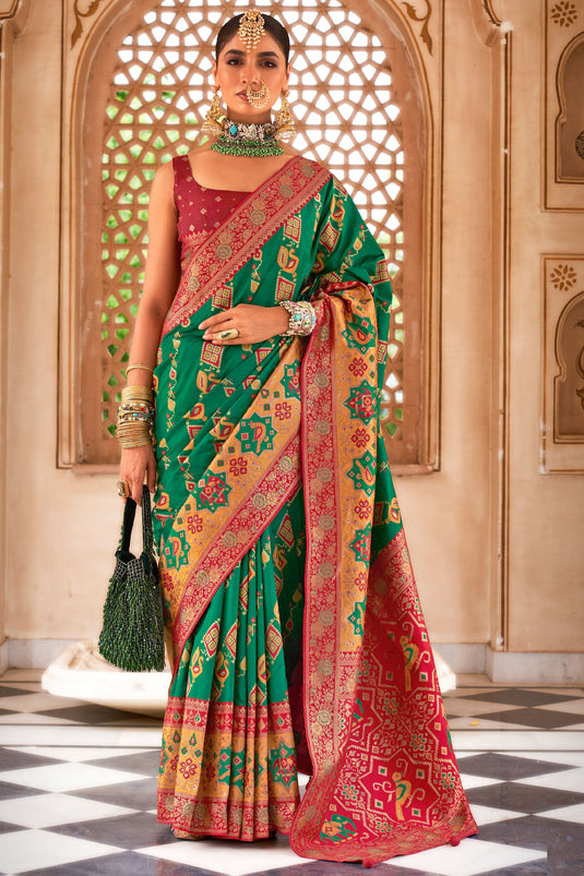 Beguiling Patola Weaving Work On Green Color Art Silk Fabric Saree