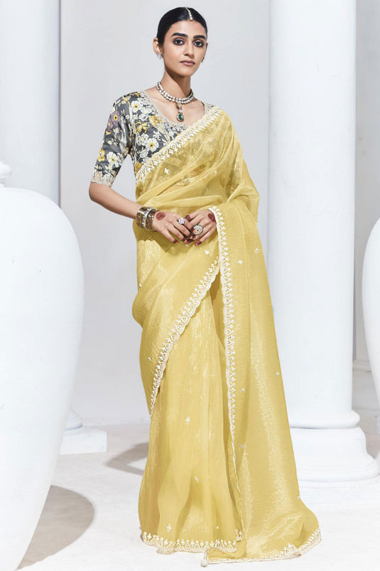 Marvellous Border Work On Organza Fabric Saree In Yellow Color