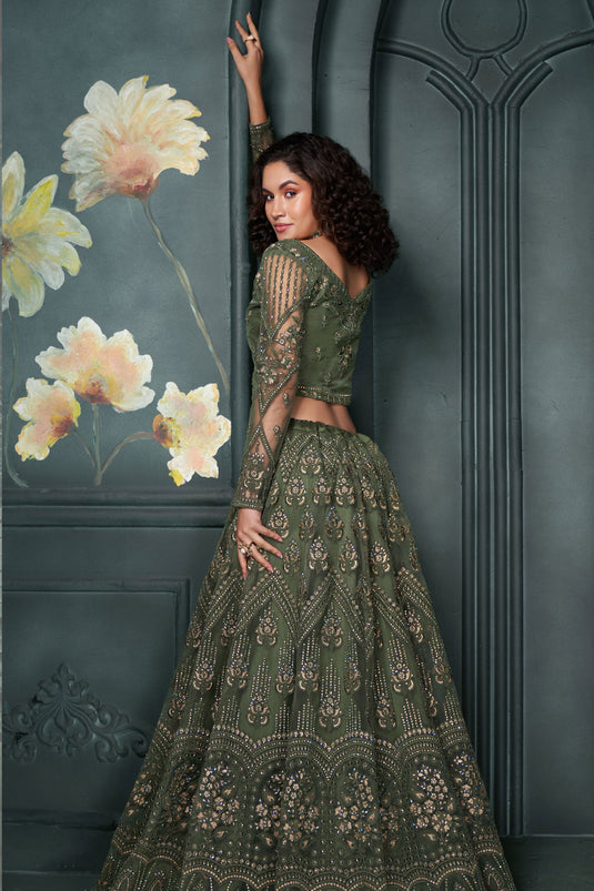 Soothing Embroidered Work On Mehendi Green Color Net Fabric Lehenga