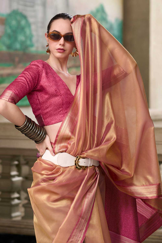 Weaving Work On Captivating Tissue Silk Fabric Saree In Peach Color