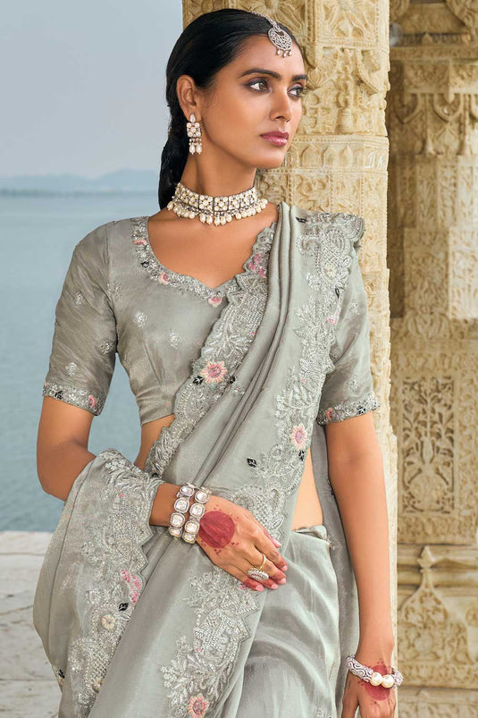 Banarasi Fabric Heavy Embroidered Work Mesmeric Saree In Grey Color