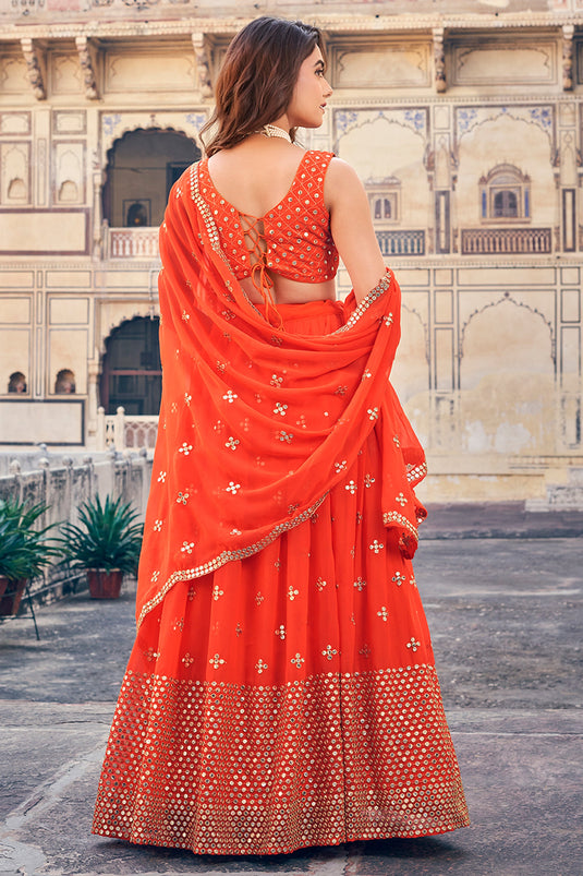 Awesome Embroidered Work On Georgette Fabric Orange Color Lehenga