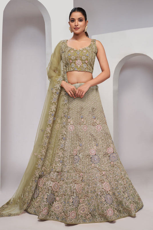 Sequins Work On Net Fabric Bewitching Lehenga In Olive Color
