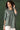 Tempting Rayon Fabric Olive Green Color Short Kurti With Embroidered Work