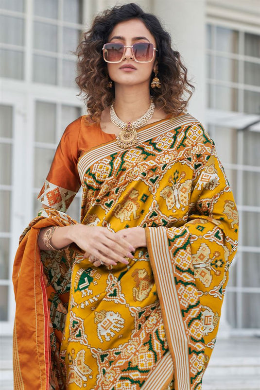 Mustard Color Patola Silk Fabric Royal Weaving Work Saree