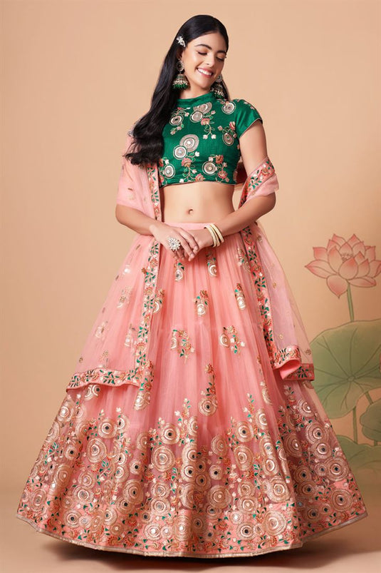 Dazzling Sangeet Wear Peach Color Lehenga Choli In Net Fabric