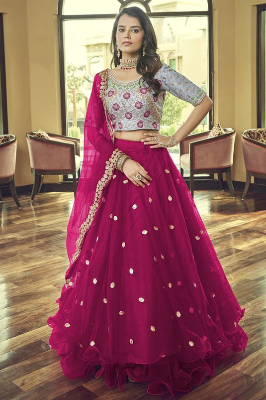 Classic Embroidered Work On Rani Color Lehenga In Net Fabric