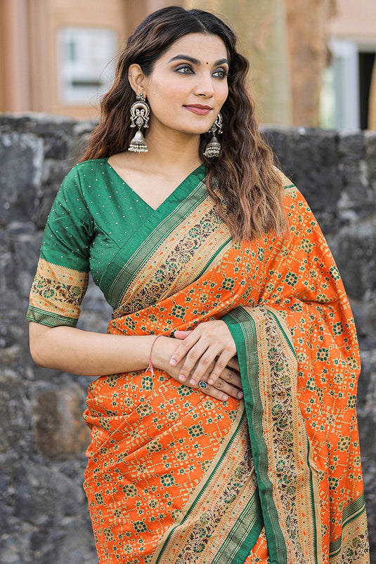 Dola Silk Fabric Printed Patola Orange Color Saree