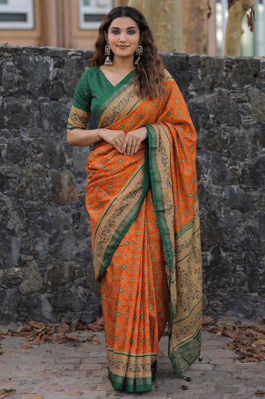 Dola Silk Fabric Printed Patola Orange Color Saree