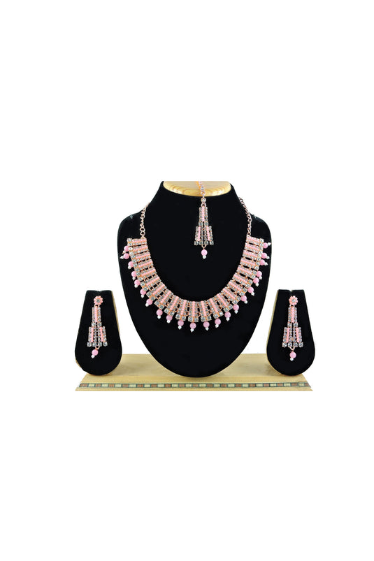 Engaging Pink Color Alloy Material Necklace Set Earrings And Mang Tikka For Women