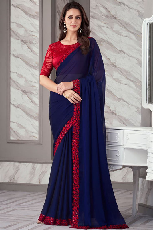 Larissa Bonesi Blue Color Georgette Fabric Saree With Radiant Border Work