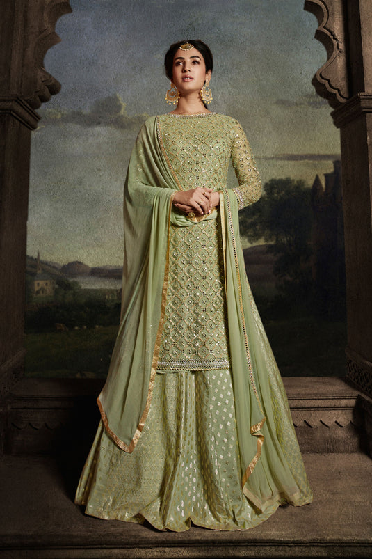 Sonal Chauhan Sea Green Color Fantastic Net Fabric Sharara Top Lehenga With Embroidered Work