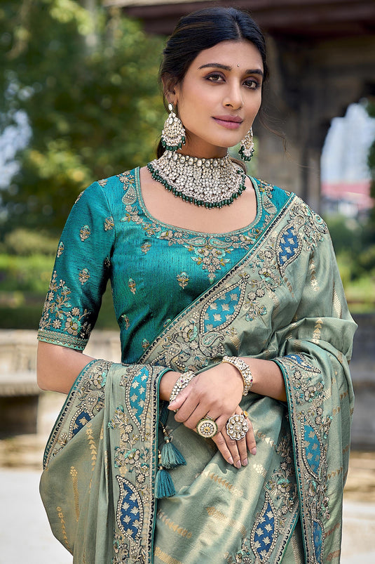 Beguiling Sea Green Color Silk Saree With Heavy Embroidered Blouse