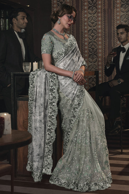 Heavy Embroidery Work Beguiling Sea Green Color Net Saree With Party Look Blouse