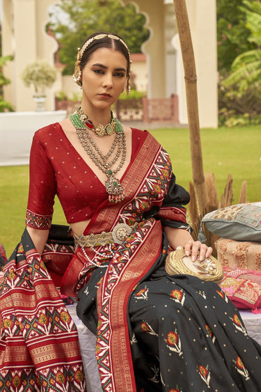 Delightful Black Printed Patola Silk Function Wear Saree