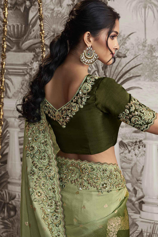 Delicate Green Color Heavy Embroidery Work Fancy Fabric Saree With Party Look Blouse