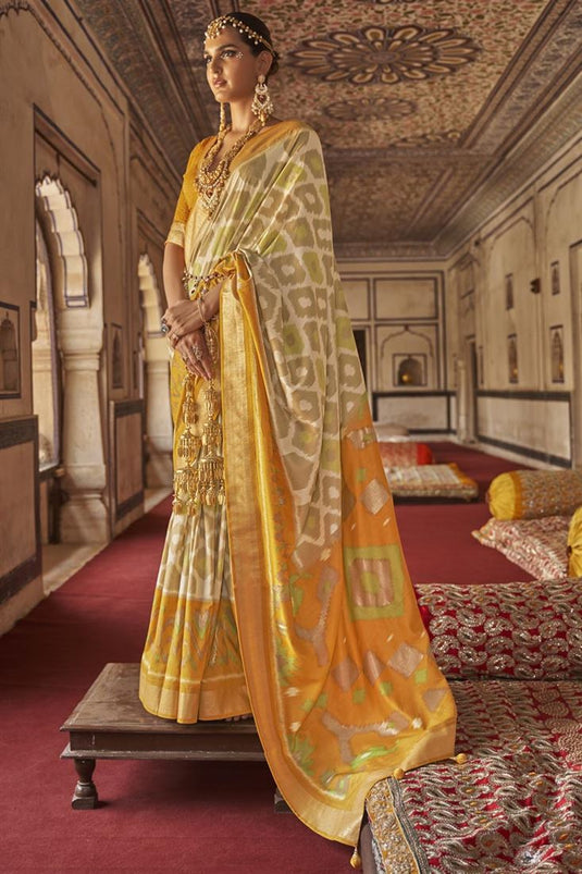 Patola Silk Fabric Cream Color Function Wear Intriguing Saree With Printed Work