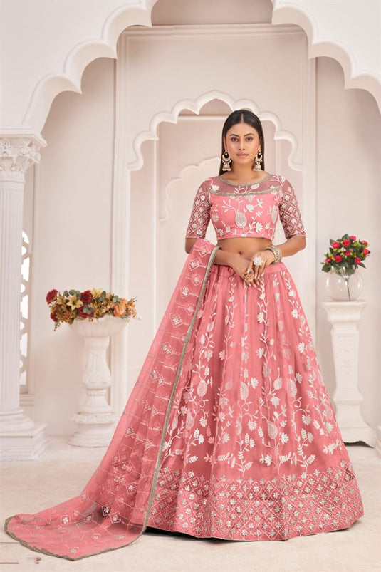 Captivating Peach Color Net Fabric Embroidered Lehenga