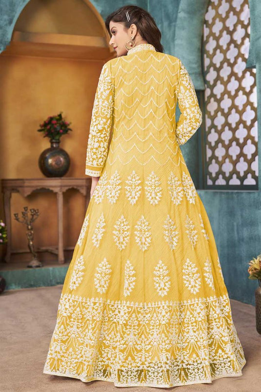 Function Wear Net Fabric Ingenious Embroidered Work Anarkali Suit In Yellow Color